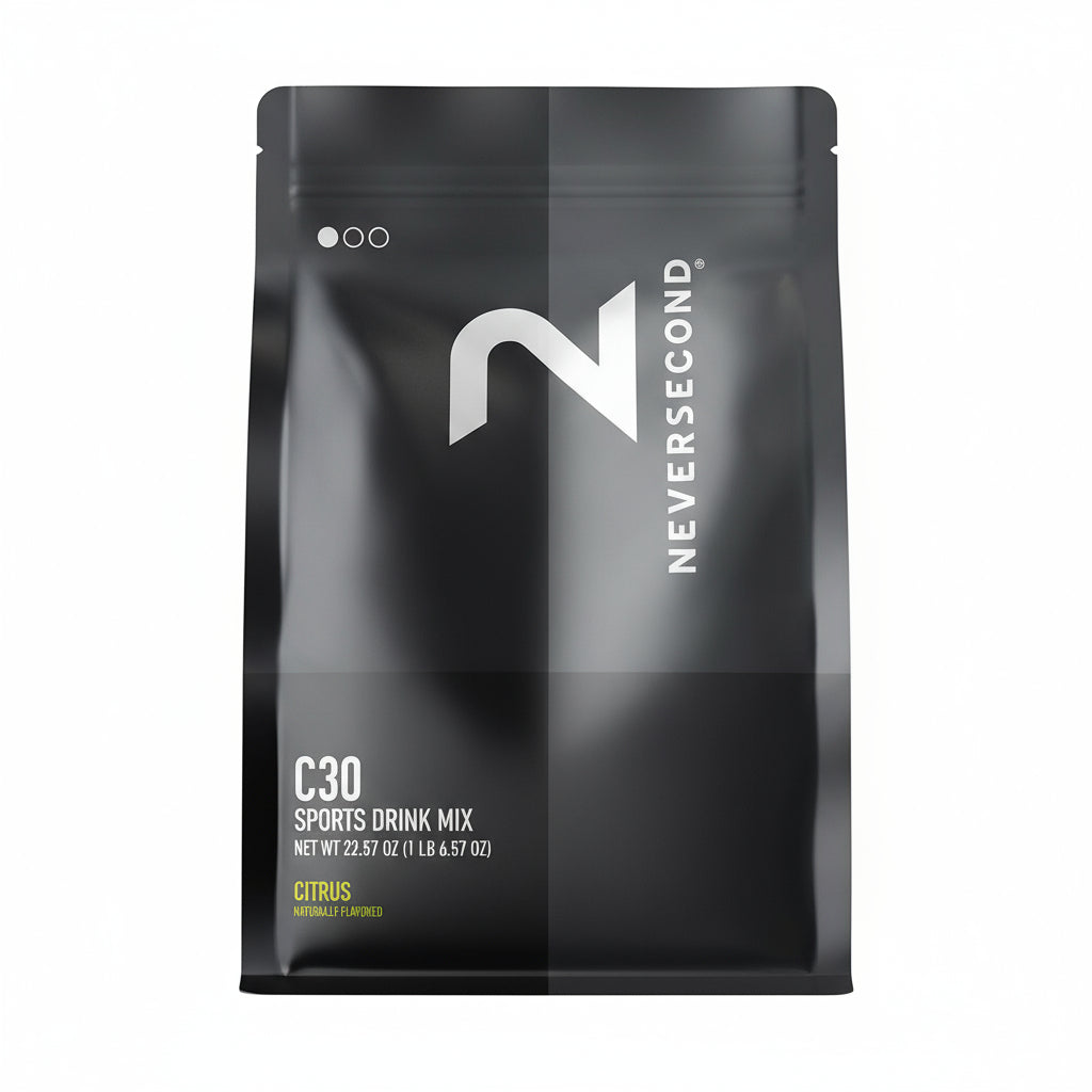 Black package of Neversecond C30 Sports Drink Mix on a light gray background