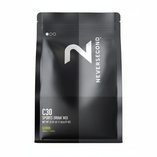 Black package of Neversecond C30 Sports Drink Mix on a light gray background