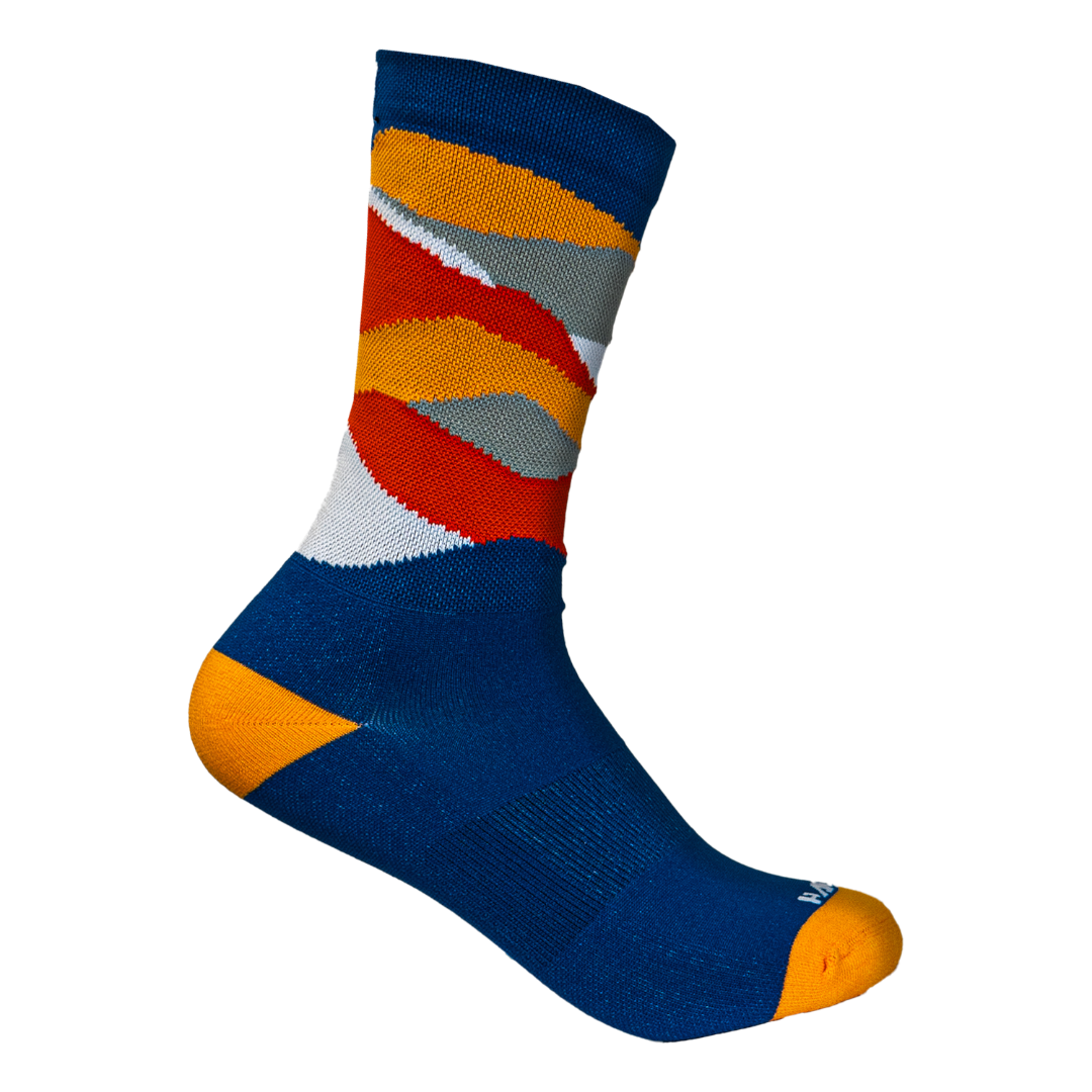 Colorful sock with blue, orange, red, and gray pattern on a white background