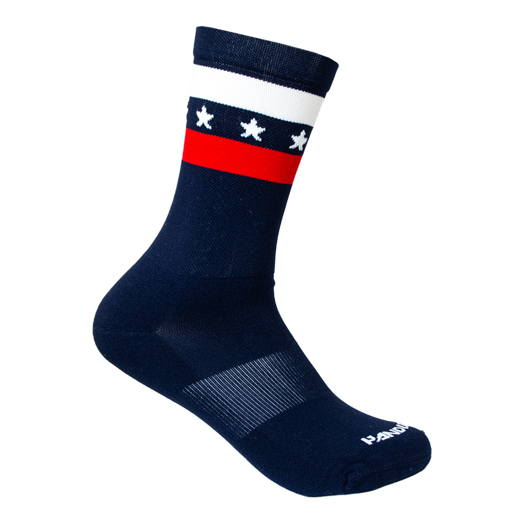 Navy sock with white stars and a red band on a white background