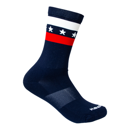 Navy sock with white stars and a red band on a white background