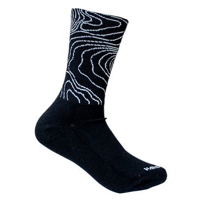 Black sock with white abstract pattern on a white background