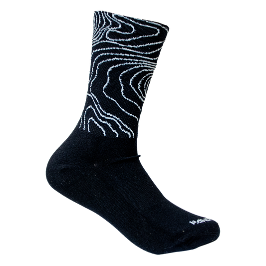Black sock with white abstract pattern on a white background
